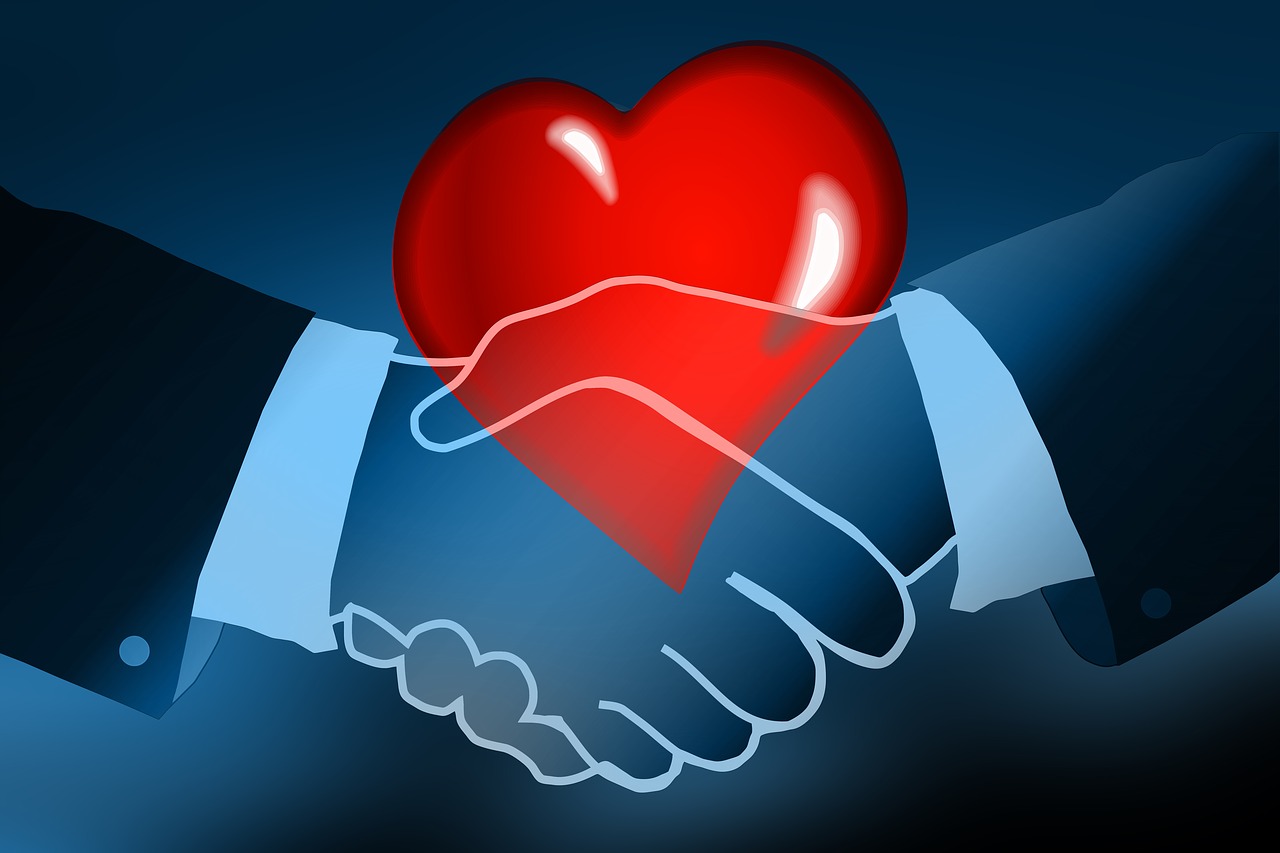 Cartoon heart with handshake overtop