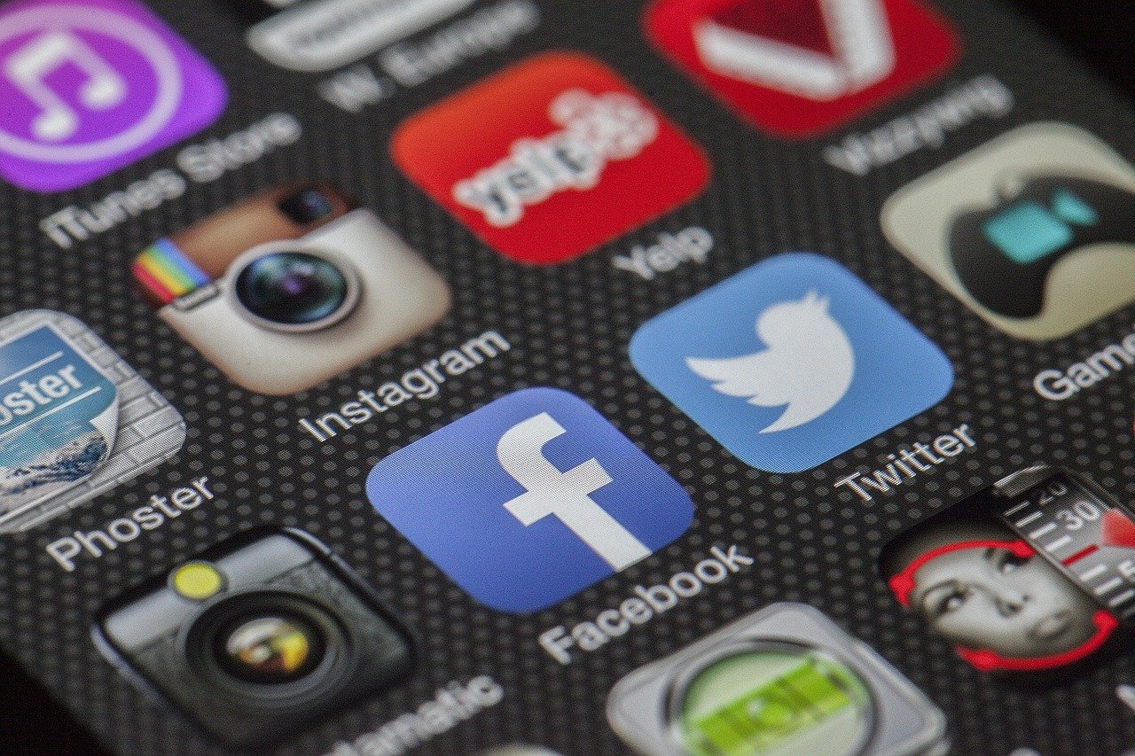 Social media apps on mobile phone close-up