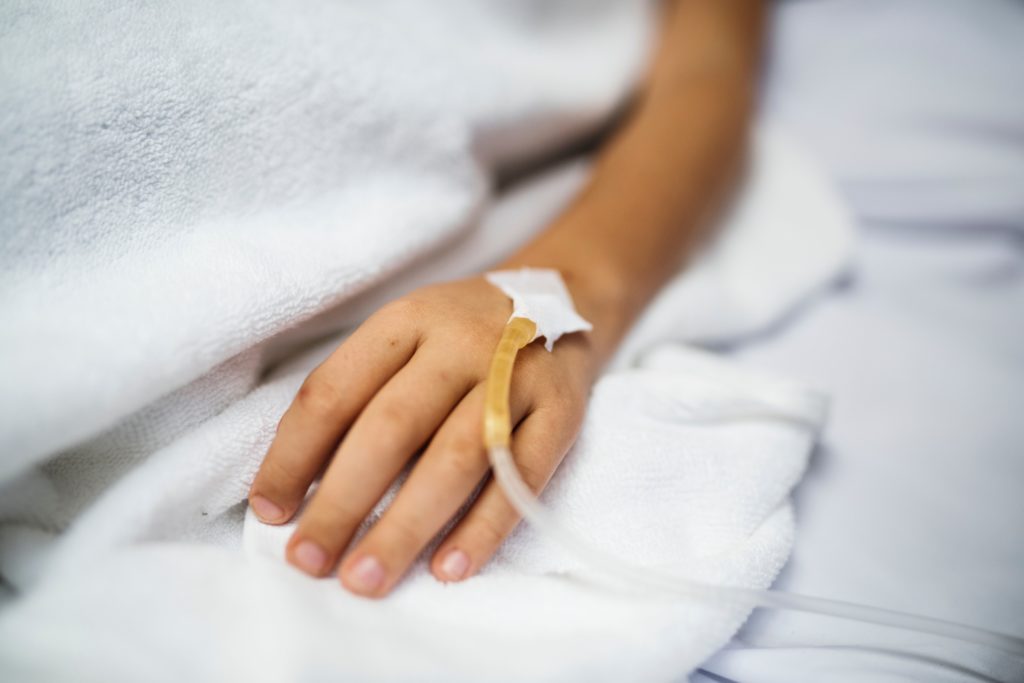 IV in patient's hand at hospital
